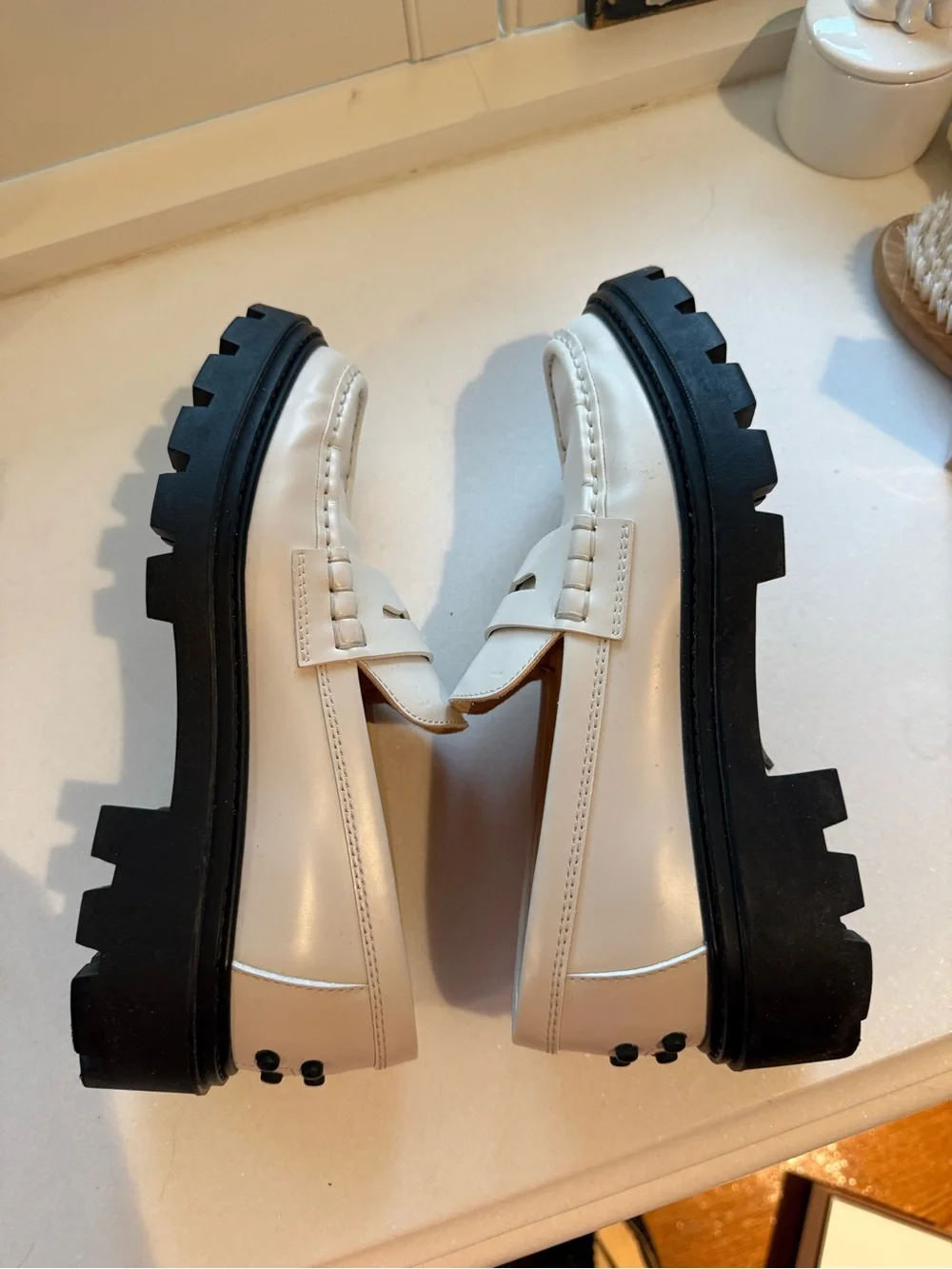 Tod’s Women’s White Leather Penny Loafers with Black Lug Sole - Picture 4 of 7